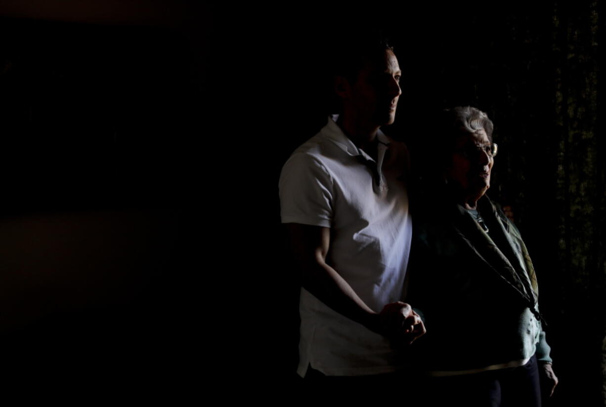 One of the founders of Grandmothers of Plaza de Mayo, Delia Giovanola, poses for a picture with her grandson Martin Ogando in Buenos Aires, Argentina. Her grandson, Martin, is the 118th grandchild to be located by the group through a National Genetic Data Bank. To date, 122 cases of stolen children have been resolved, but several hundred remain unaccounted for.