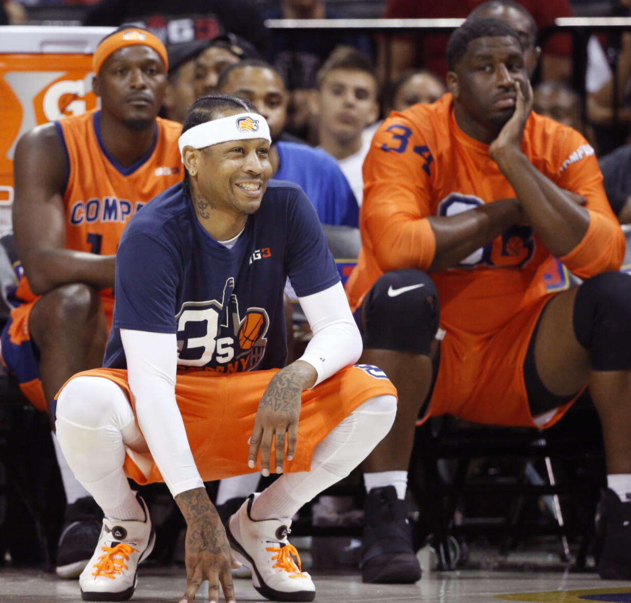 3's Company player/captain and coach Allen Iverson, center, kneels on the sideline during the first half of Game 3 in the BIG3 Basketball League debut, Sunday, June 25, 2017, at the Barclays Center in New York.