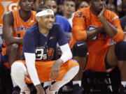 3's Company player/captain and coach Allen Iverson, center, kneels on the sideline during the first half of Game 3 in the BIG3 Basketball League debut, Sunday, June 25, 2017, at the Barclays Center in New York.