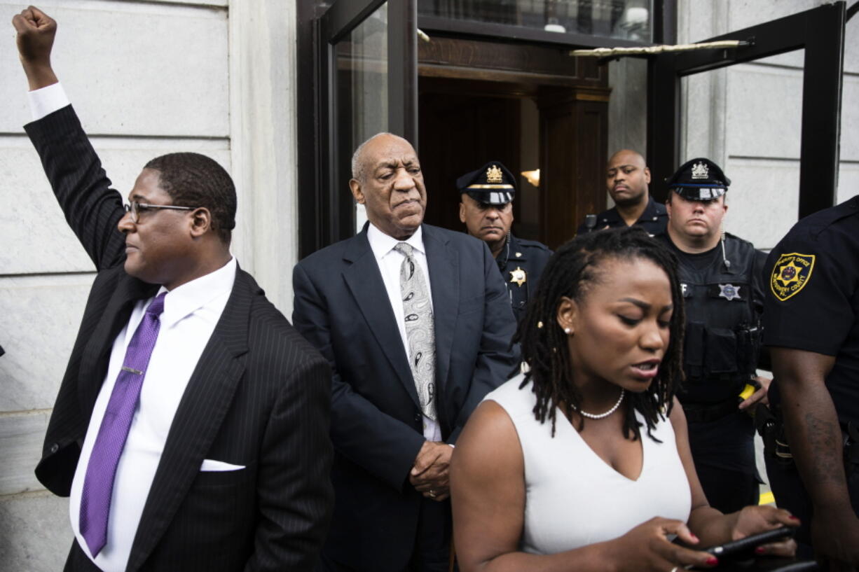 Bill Cosby listens to his wife Camille’s statement being read aloud by Ebonee M. Benson outside the Montgomery County Courthouse after a mistrial in his sexual assault case in Norristown, Pa., Saturday. Cosby’s trial ended without a verdict after jurors failed to reach a unanimous decision.