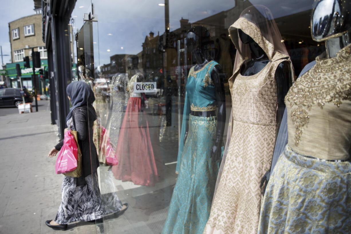 A shopper walks out of Upton Park on May 22 in London. “Mainstream fashion is now talking about modest fashion as a thing. Ten years ago, if you were a brand coming from a religious background and tried to sell it in department stores, calling it a modest or Muslim brand would be a kiss of death,” said Reina Lewis, a professor at the London College of Fashion who has written two books about the topic. While the majority of those interested in covered-up fashion are young, cosmopolitan Muslim women, “the term ‘modesty’ emerged in the niche market as a useful one because it’s not faith-specific,” Lewis added.