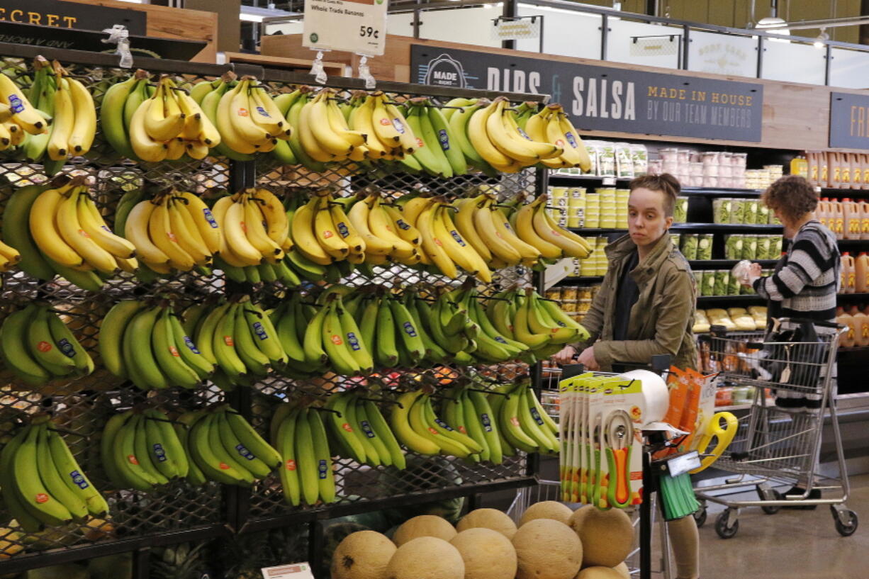 Customers shop in May at a Whole Foods Market in Upper Saint Clair, Pa. AmazonÇƒÙs planned $13.7 billion acquisition of Whole Foods signals a massive bet that people will opt more for the convenience of online orders and delivery or in-store pickup, putting even more pressure on the already highly competitive industry. (AP Photo/Gene J.