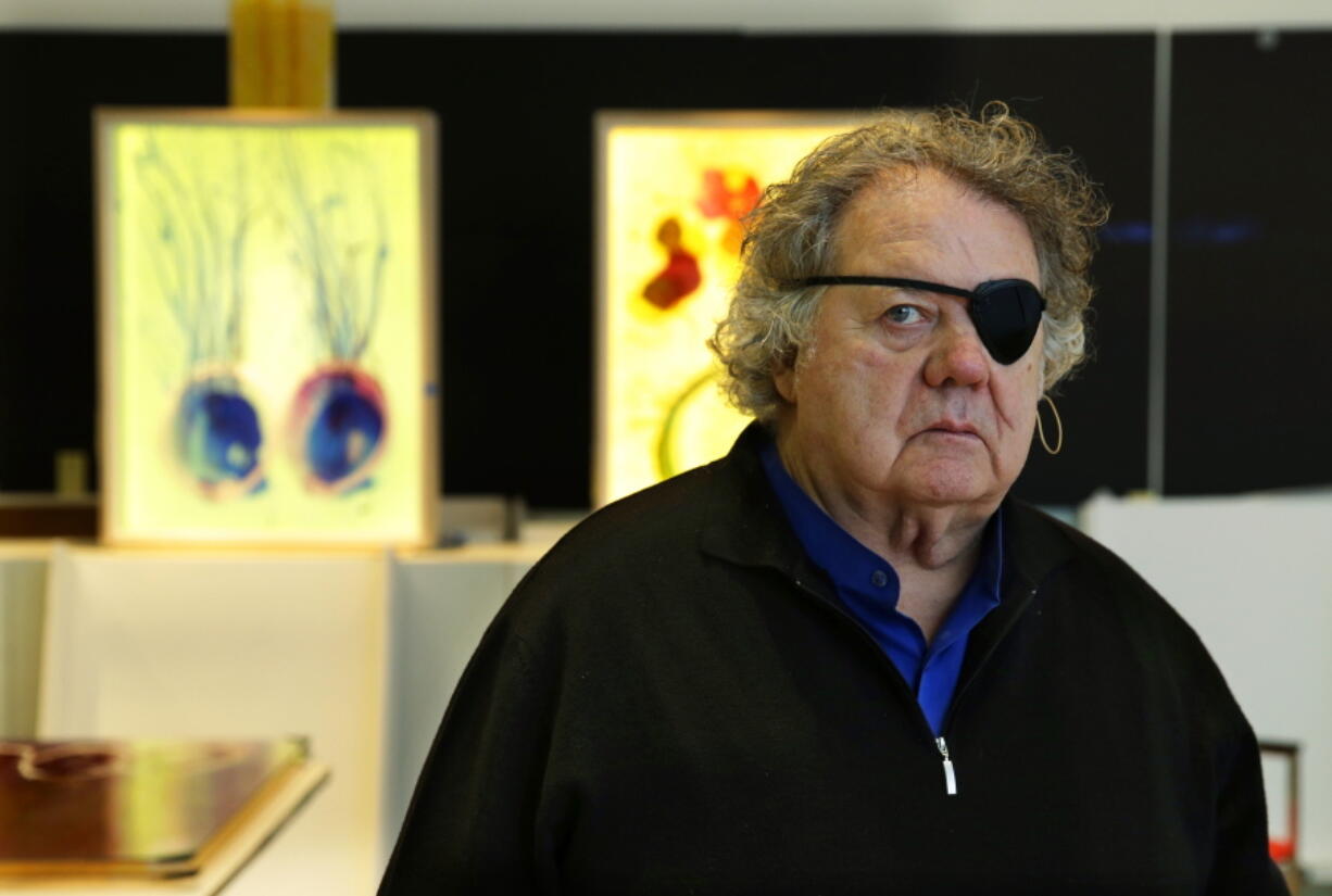 Glass artist Dale Chihuly poses March 22, 2017, in one of his studios in Seattle. Chihuly is a pioneer of the glass art movement and is internationally known for styles that include vibrant seashell-like shapes and ambitious installations in botanical gardens and museums. He lost sight in his left eye in a 1976 car crash. (AP Photo/Ted S.