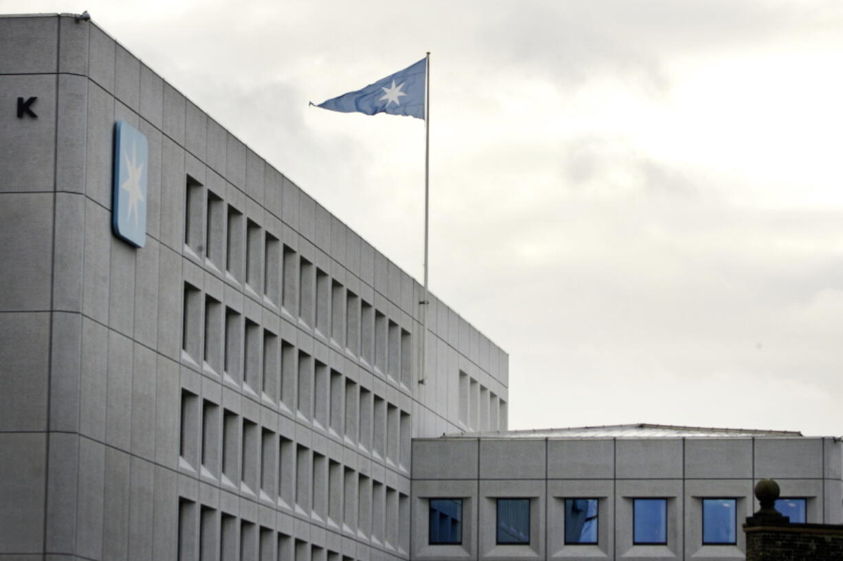 A flag files over the headquarters of shipping company A.P. Moller-Maersk in Copenhagen, Denmark.