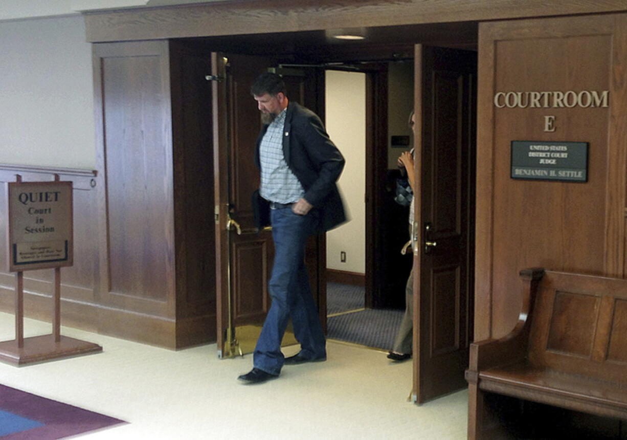 Former National Guard soldier Darryl Lee Wright leaves a courtroom at the U.S. District Court in Tacoma. Wright on Thursday was sentenced to three years in prison for lying his way to a Purple Heart.