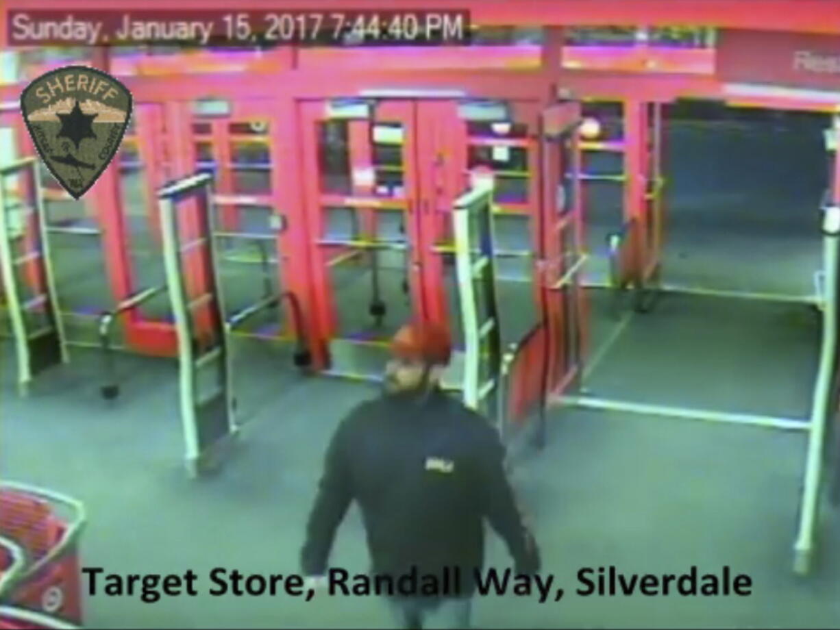 This Jan. 15 surveillance video shows someone detectives describe as a person of interest in the January slayings of four members of the same family. The video shows the man at a Target store in Silverdale, about 15 miles west of Seattle, 12 days before the killings took place.