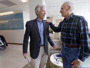 Dr. David Maloney of the Fred Hutchinson Cancer Research Center in Seattle is greeted by patient Ken Shefveland of Vancouver, whose lymphoma was successfully treated with CAR-T cell therapy. Immune therapy is the hottest trend in cancer care and its next frontier is creating “living drugs” that grow inside the body into an army that seeks and destroys tumors.