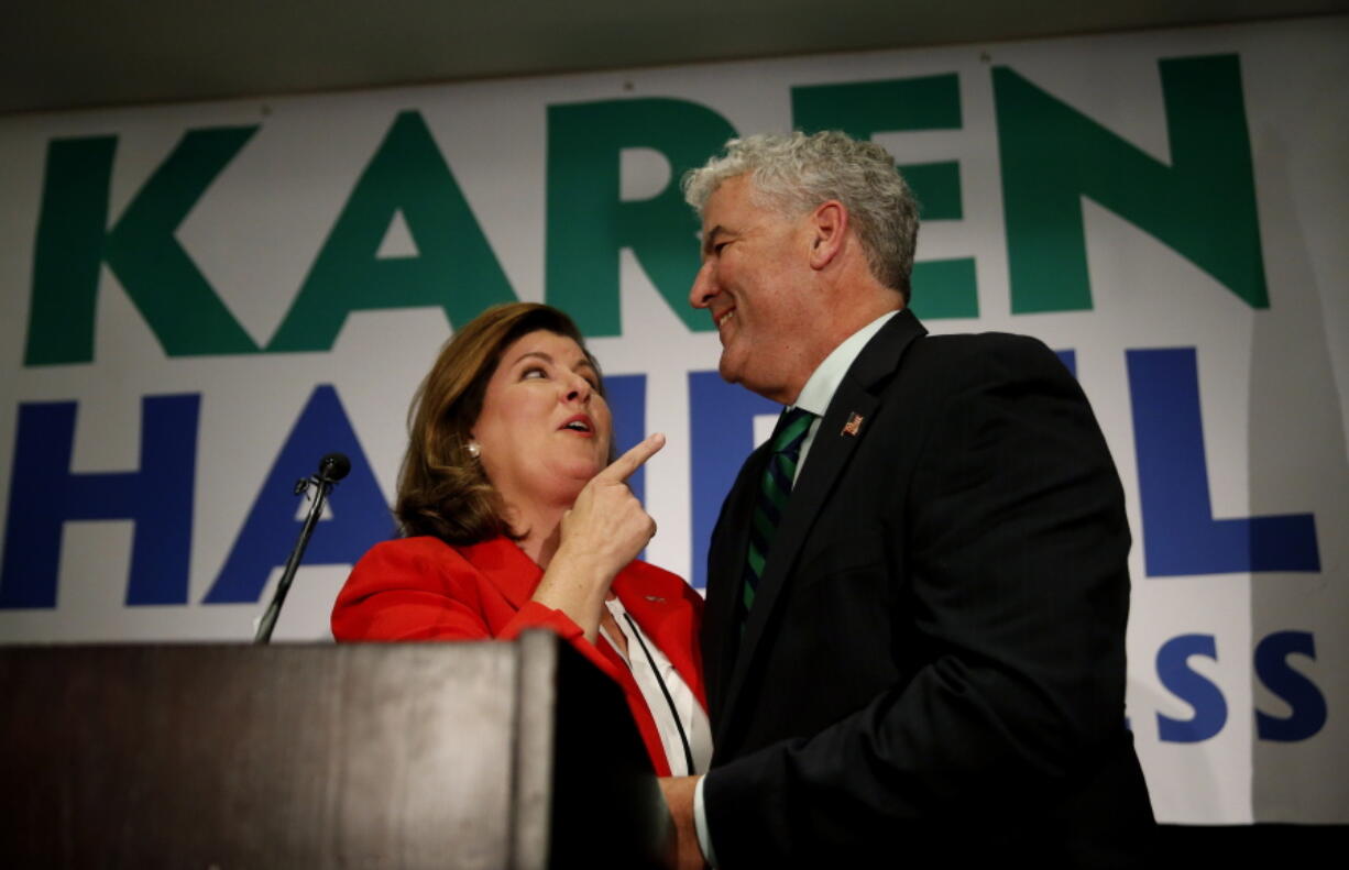 Republican candidate for Georgia’s Sixth District congressional seat Keran Handel stands with her husband Steve as she declares victory during an election-night watch party Tuesday in Atlanta.