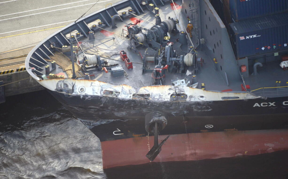 The container ship ACX Crystal with its left bow dented and scraped after colliding with the USS Fitzgerald in the waters off the Izu Peninsula earlier in the day Saturday, is berthed at the Oi Container Terminal in Tokyo. The search for seven U.S. Navy sailors missing after their destroyer collided with the container ship called off Sunday after several bodies were found in the ship’s flooded compartments, including sleeping quarters. All of the ACX Crystal’s 20-member Filipino crew were safe, said Japanese shipping company Nippon Yusen K.K., which operates the Philippine-flagged ship.