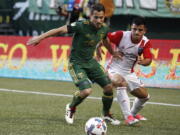 Portland Timbers' Sebastian Blanco (10) tries to hold possession against San Jose Earthquakes' Nick Lima during an MLS soccer match in Portland, Ore., Friday, June 2, 2017.