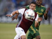 Colorado Rapids defender Mike da Fonte, front, pursues the ball with Portland Timbers forward Dairon Asprilla in the first half Saturday.