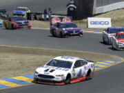 Kevin Harvick (4) leads through a turn during the NASCAR Sprint Cup Series auto race Sunday, June 25, 2017, in Sonoma, Calif.