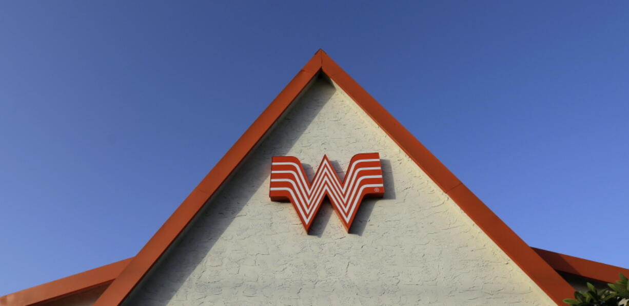 FILE - This Thursday, July 9, 2015, file photo shows a Whataburger restaurant in San Antonio, Texas. The Texas restaurant chain said on social media Wednesday, June 28, 2017, that a story shared online that claims it would be going out of business on Aug. 1 is a hoax.