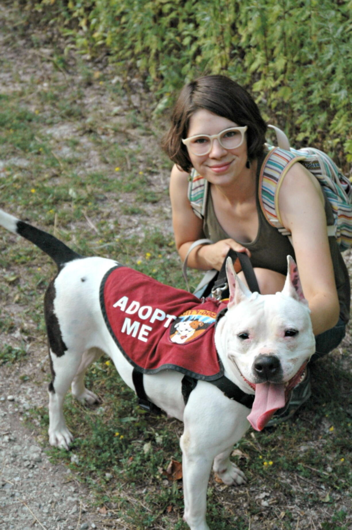 This undated photo provided by the ASPCA shows dog Lola and Adoption Ambassador Lily Draheim in Cleveland, Ohio. Pamela Hercik adopted Lola from Lily through the Cleveland Animal Care & Control’s “City Dogs Cleveland” Adoption Ambassador program.