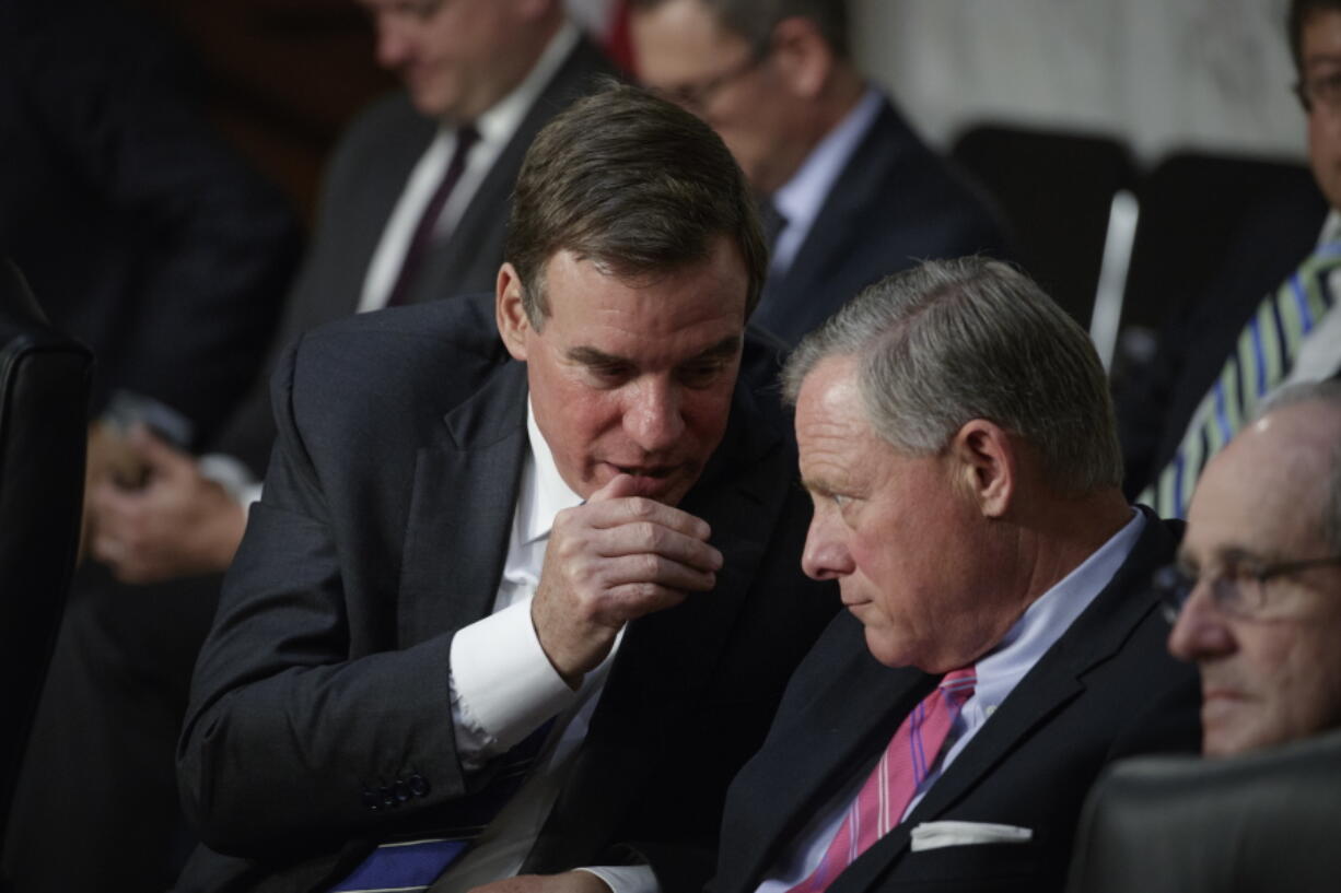 Senate Intelligence Committee Chairman Sen. Richard Burr, R-N.C., right, and committee Vice Chairman Mark Warner, D-Va., confer on Capitol Hill in WashingtonWednesday, June 28, 2017, as the panel conducts a hearing on Russian intervention in European elections in light of revelations by American intelligence agencies that blame Russia for meddling in the 2016 U.S. election. (AP Photo/J.