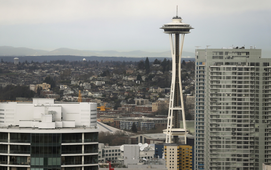 FILE--In this Feb. 17, 2016, file photo, the Space Needle is shown as viewed from a building in downtown Seattle. A new lawsuit is challenging Seattle’s first-in-the-nation voucher system for publicly financing political campaigns. The libertarian-leaning law firm Pacific Legal Foundation is suing the city over its new “democracy voucher” program, which was passed by voters in 2015 and is being used for the first time in this year’s City Council races. (AP Photo/Ted S.