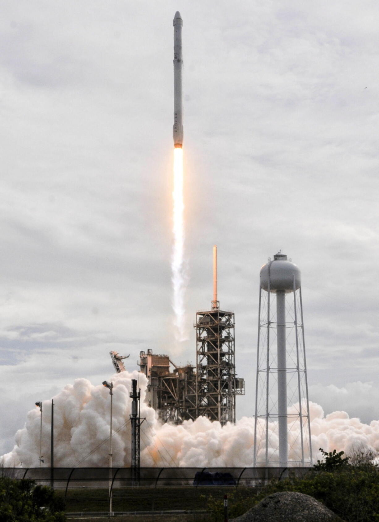 The SpaceX Falcon 9 rocket, with the Dragon spacecraft onboard, launches from NASA’s Kennedy Space Center on Saturday in Cape Canaveral, Fla.