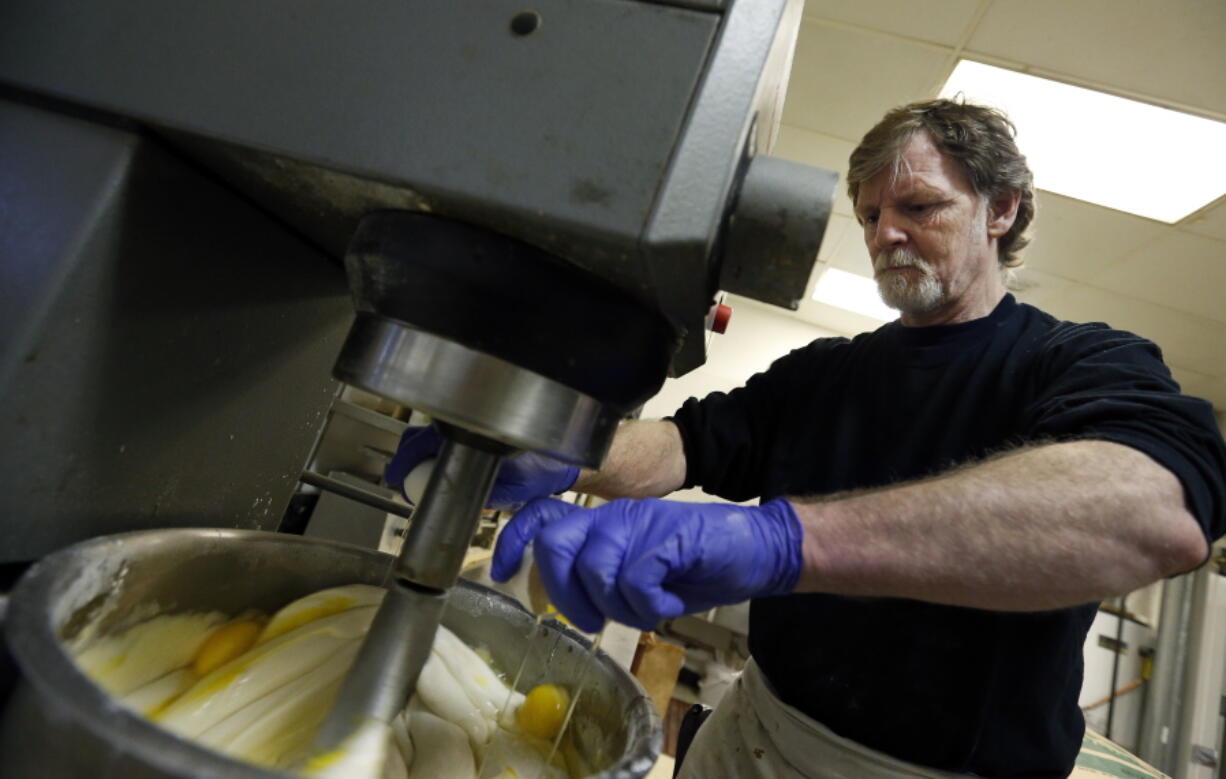 Masterpiece Cakeshop owner Jack Phillips cracks eggs into a cake batter mixer inside his store in Lakewood, Colo., on March 10, 2014. The Supreme Court is taking on a new clash between gay rights and religion in a case about a wedding cake for a same-sex couple in Colorado. The justices said Monday, June 26, 2017, they will consider whether a baker who objects to same-sex marriage on religious grounds can refuse to make a wedding cake for a gay couple.