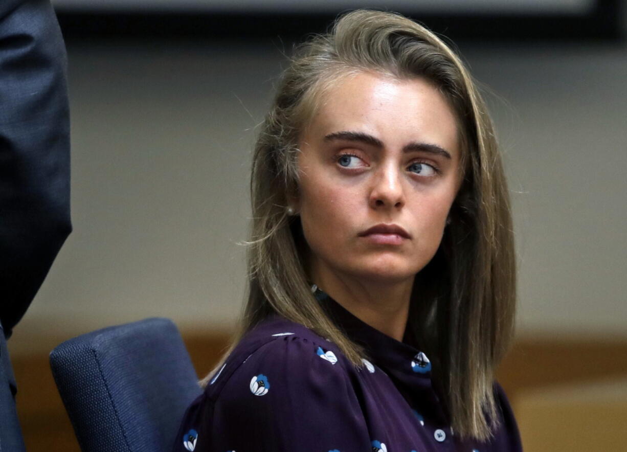 Defendant Michelle Carter listens to testimony at Taunton District Court in Taunton, Mass., in Taunton, Mass., Thursday, June 8, 2017. Carter is charged with involuntary manslaughter for encouraging Conrad Roy III to kill himself in July 2014.