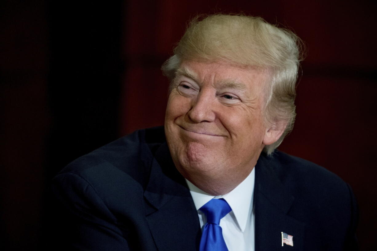 President Donald Trump attends a roundtable on infrastructure Friday at the Department of Transportation in Washington.