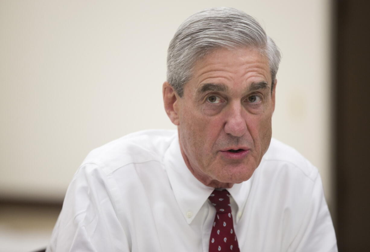 Outgoing FBI director Robert Mueller speaks during an interview at FBI headquarters, in Washington on Aug. 21, 2013. Muller, the special counsel investigating possible ties between President Donald TrumpÇƒÙs campaign and RussiaÇƒÙs government has taken over a separate criminal probe involving former Trump campaign chairman Paul Manafort, and may expand his inquiry to investigate the roles of the attorney general and deputy attorney general in the firing of FBI Director James Comey, The Associated Press has learned.