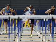 From left, Devon Allen, Aries Merritt, and Aleec Harris run the men's 110-meter hurdles at the U.S. Track and Field Championships, Sunday, June 25, 2017, in Sacramento, Calif. Harris won the event, Merritt finished second, and Allen finished third.