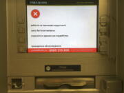 A screen of an idle virus affected cash machine in a state-run OshchadBank says “Sorry for inconvenience/Under repair” in Kiev, Ukraine, Wednesday, June 28, 2017. The cyberattack ransomware that has paralyzed computers across the world hit Ukraine hardest Tuesday, with victims including top-level government offices, energy companies, banks, cash machines, gas stations, and supermarkets.