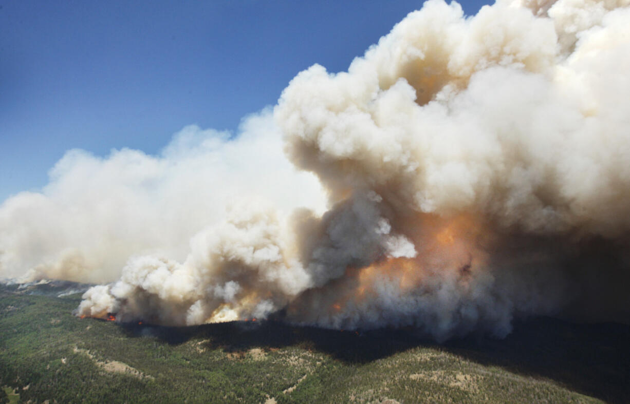 The Brian Head Fire continues to grow near Brian Head, Utah. The blaze is 8 percent contained and has destroyed at least 12 homes and eight outbuildings.