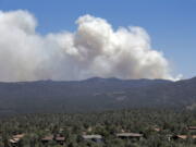 A wildfire burns near Mayer, Ariz, Wednesday, June 28, 2017, as seen from Prescott Valley, Ariz. The fire about 100 miles north of Phoenix has forced the evacuation of Mayer and parts of Dewey-Humboldt along with several other communities. Some areas and subdivisions are under pre-evacuation notices.