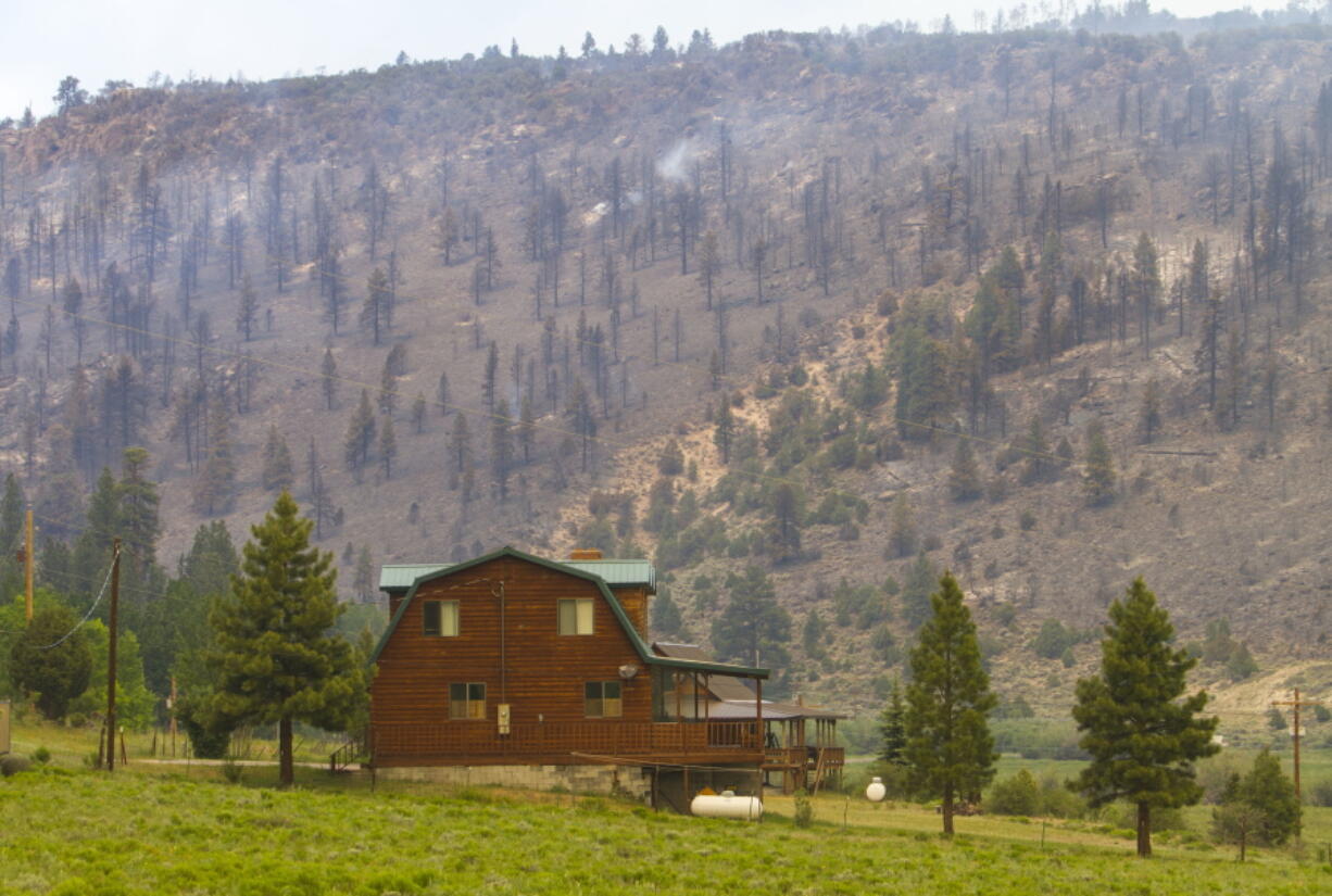 A cabin near Panguitch Lake near Panguitch, Utah., that was not burned by a wildfire. Nearly 1,000 firefighters battled a Utah wildfire that grew Sunday morning that has prompted the evacuation of over a 1,000 people from hundreds of homes and cabins.