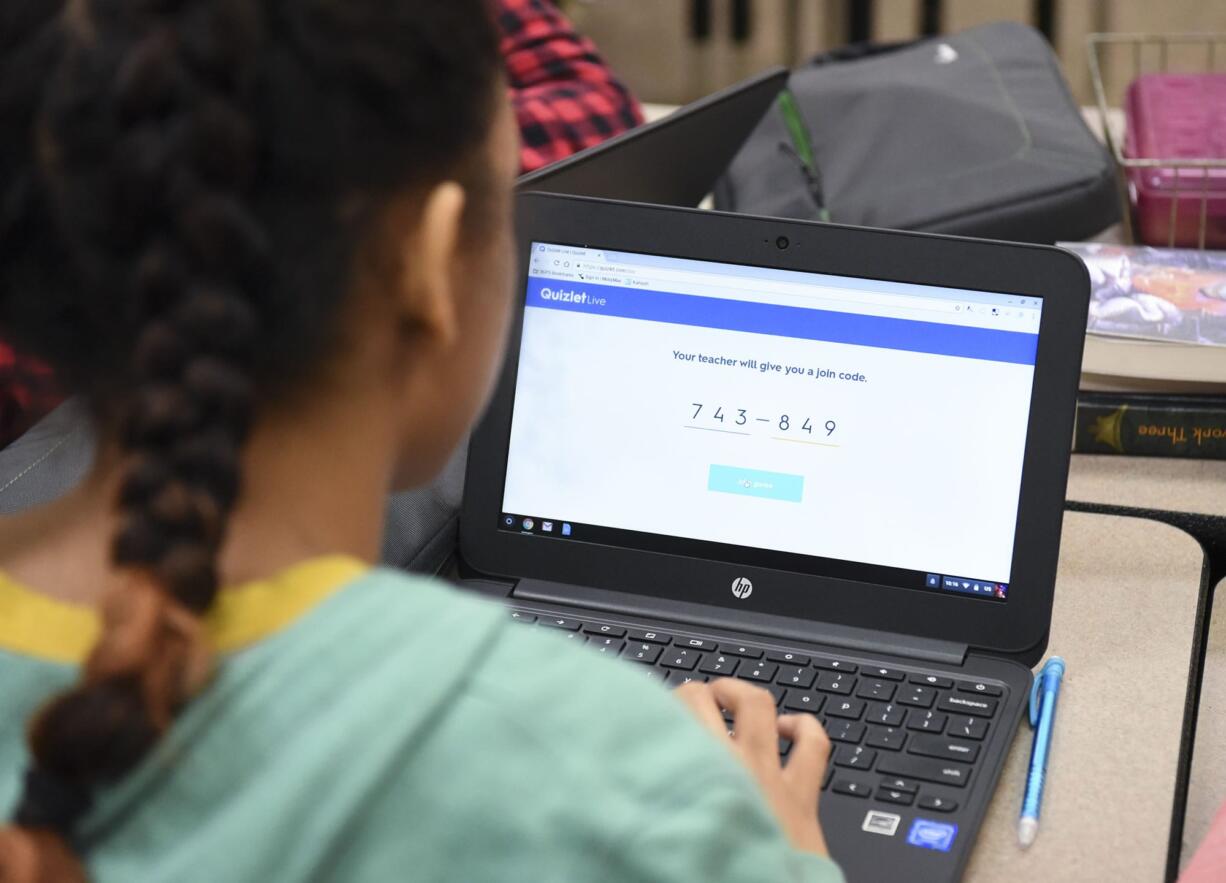 A Pleasant Valley Middle School seventh grader logs into an online learning game on her Chromebook during study hall at Pleasant Valley Middle School, Thursday February 9, 2017.