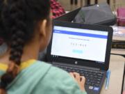 A Pleasant Valley Middle School seventh grader logs into an online learning game on her Chromebook during study hall at Pleasant Valley Middle School, Thursday February 9, 2017.