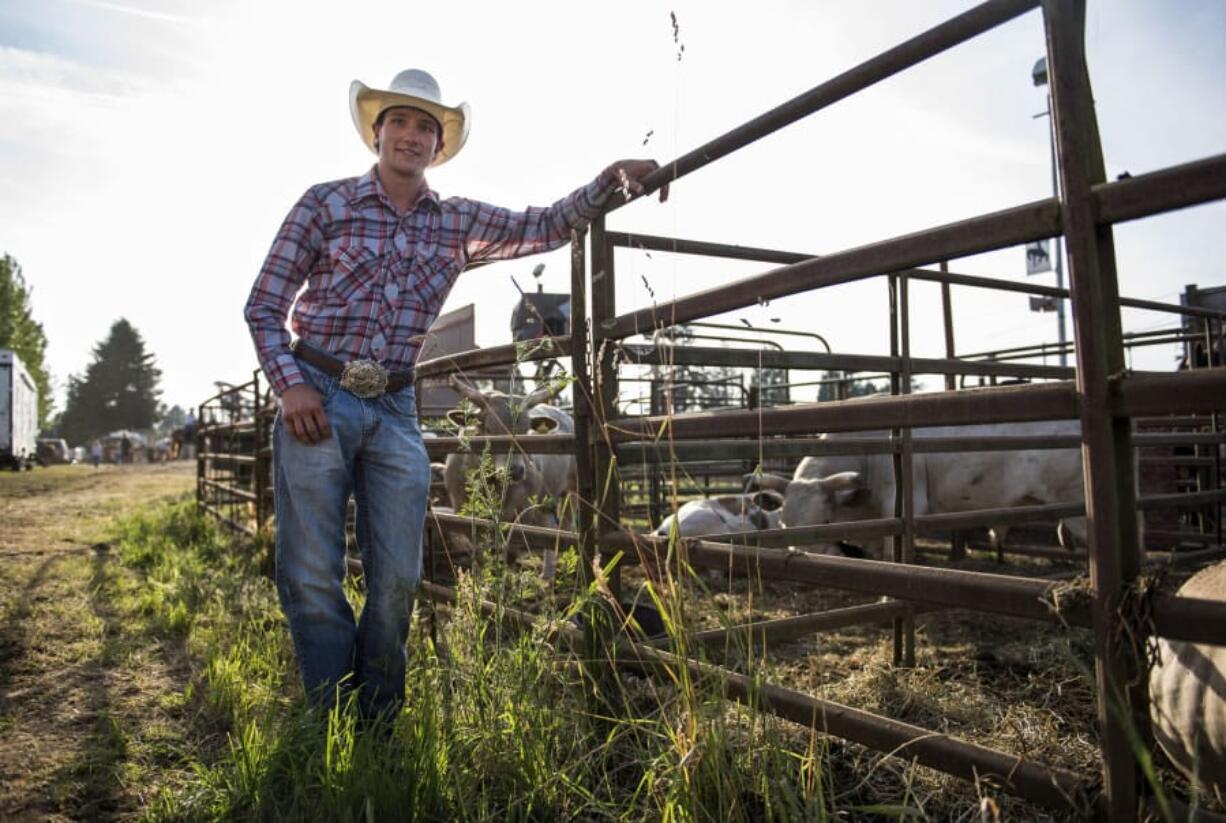 Camas native Cody Hudson stands for a portrait during the 47th annual Vancouver Rodeo at Clark County Saddle Club in Vancouver on Friday evening, June 30, 2017. After graduating from Camas High School in 2014, Hudson started bull riding professionally across the country.