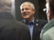 Vancouver City Councilor Larry Smith mingles at a farewell party thrown in his honor in 2015 at City Hall in Vancouver.