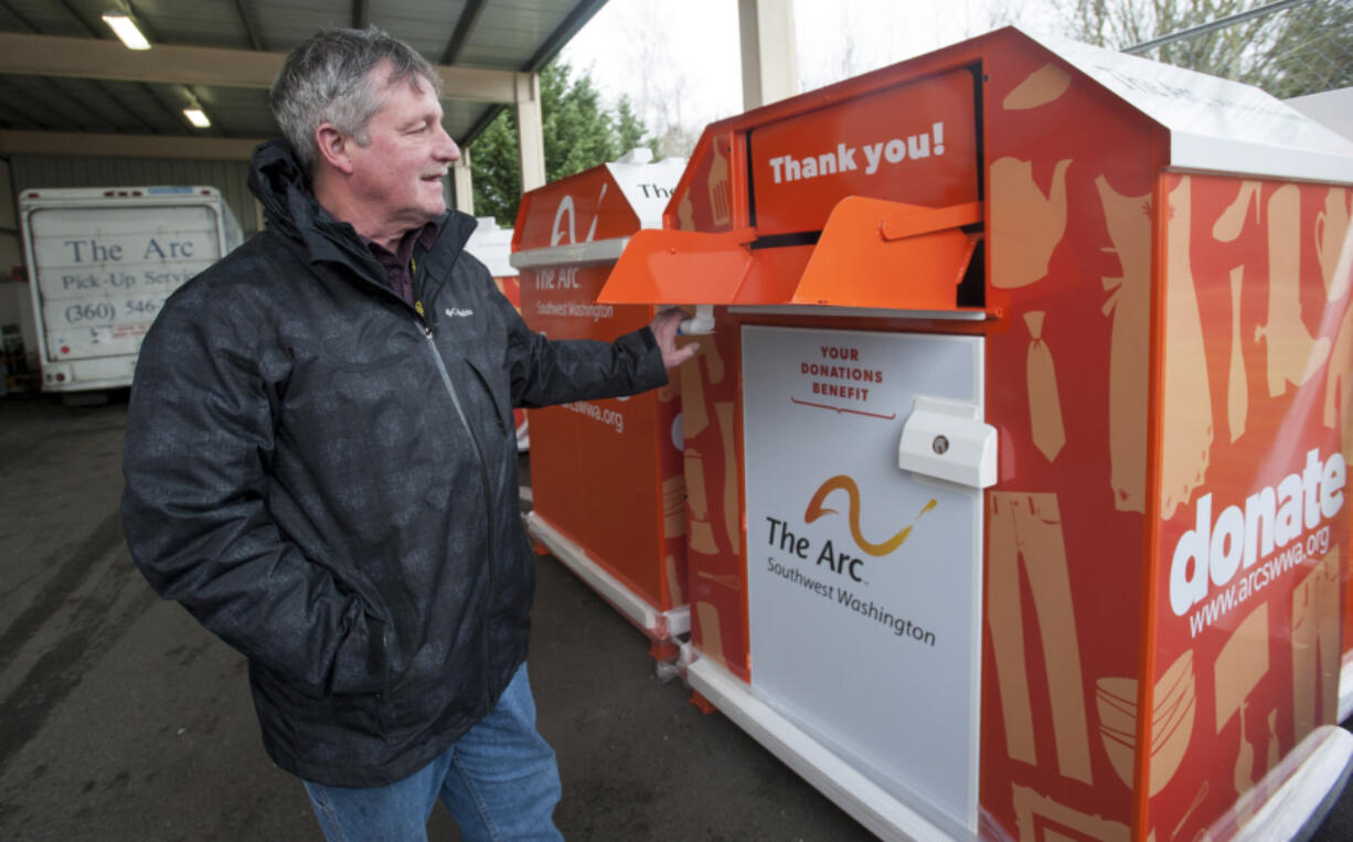 Michael Piper, then-executive director of The Arc of Southwest Washington, opens a donation bin in January 2016. The Arc has extended its relationship with Savers and may have another deal in the works to help it continue its efforts to aid people with developmental disabilities.