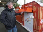 Michael Piper, then-executive director of The Arc of Southwest Washington, opens a donation bin in January 2016. The Arc has extended its relationship with Savers and may have another deal in the works to help it continue its efforts to aid people with developmental disabilities.