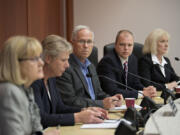 Clark County council members Jeanne Stewart, from left, Julie Olson, Marc Boldt, John Blom and Eileen Quiring discuss the contract of former Clark County Manager Mark McCauley on May 12.