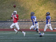 Jeremiah Wright (left) of Skyview hauls in a touchdown pass as Denis Baraiac (center) of Heritage and Devan Riggs (right) of Hockinson.