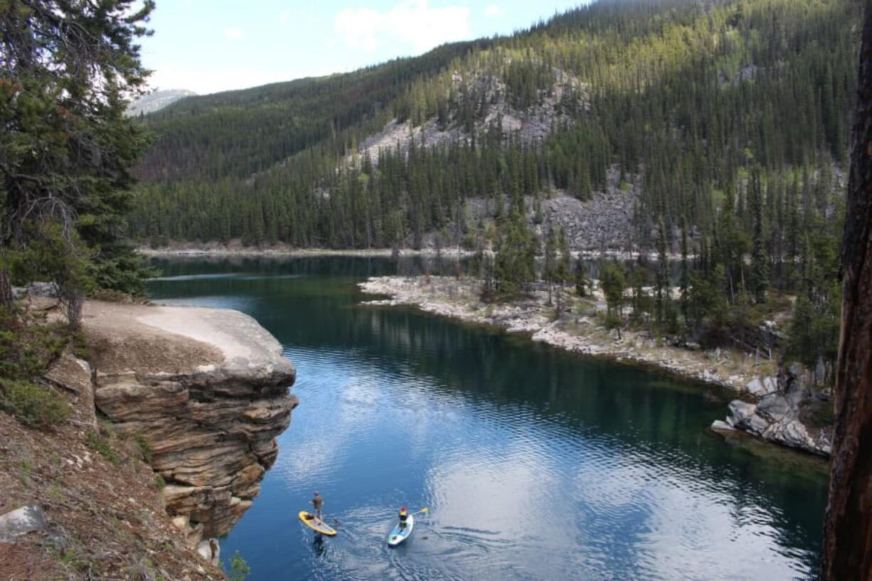 Horseshoe Lake, a favorite of swimmers who sometimes dive off its rocky outcrops, also draws a variety of paddlers to its placid waters.