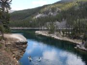 Horseshoe Lake, a favorite of swimmers who sometimes dive off its rocky outcrops, also draws a variety of paddlers to its placid waters.