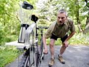 Paul Simpson shows how his homemade blender bike works. The bike helps to make strawberry milkshakes at the Lemont Strawberry Festival each summer.