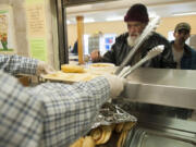 Lunch is served to the homeless at Share house in Vancouver in 2015. The city of Vancouver is taking a look Human Services Facilities ordinance which says how close services can be located to each other.