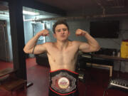 Gunnar Metzger poses with the belt he won Saturday at Rumble at the Roseland 93 in Portland. The Vancouver mixed martial arts fighter has his first professional fight Sept. 30.