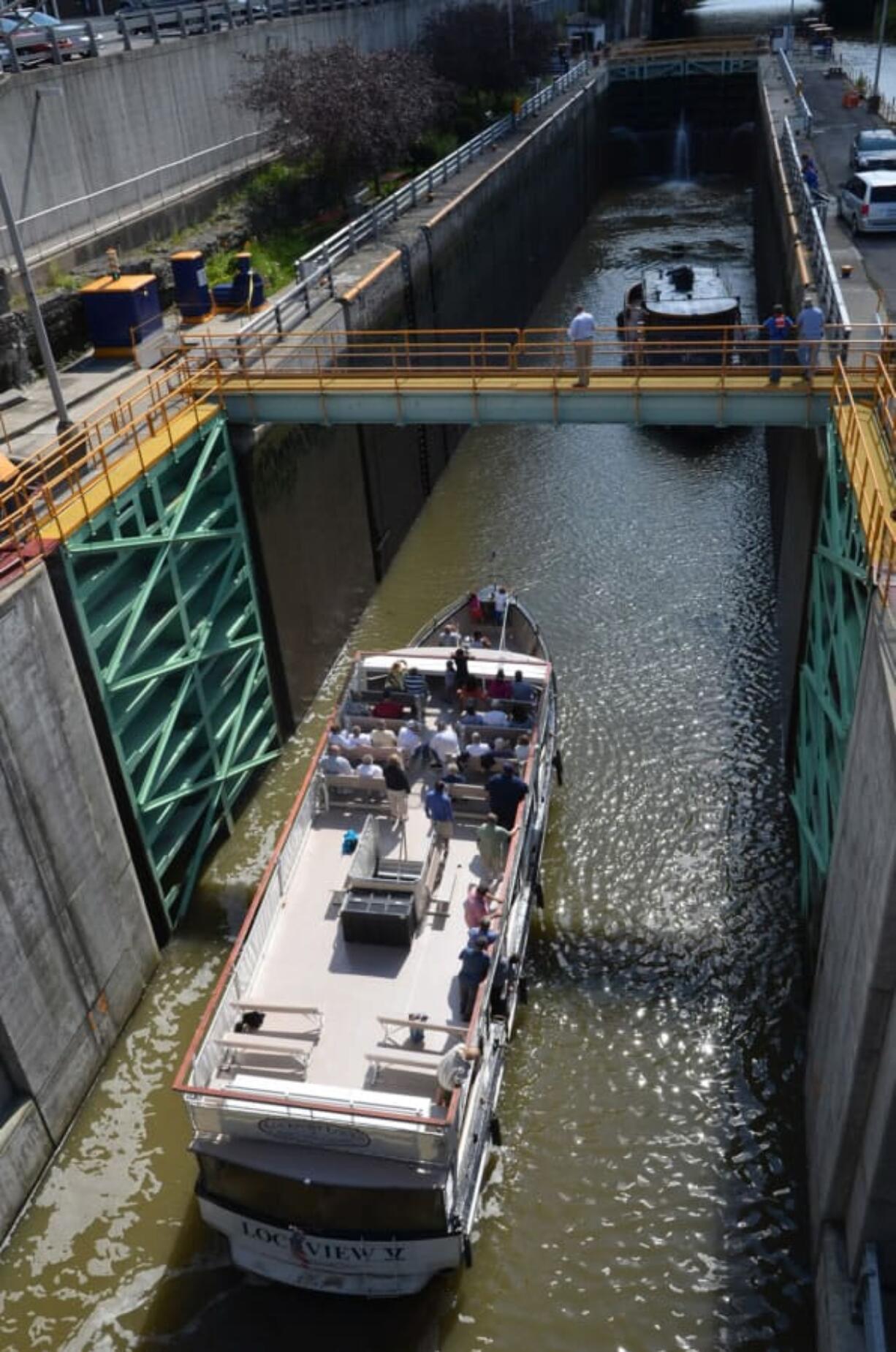 New York’s Canal System has been in continuous operation since it opened in 1825. Here, tour boats enter a lock in Lockport, N.Y.