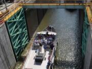 New York’s Canal System has been in continuous operation since it opened in 1825. Here, tour boats enter a lock in Lockport, N.Y.