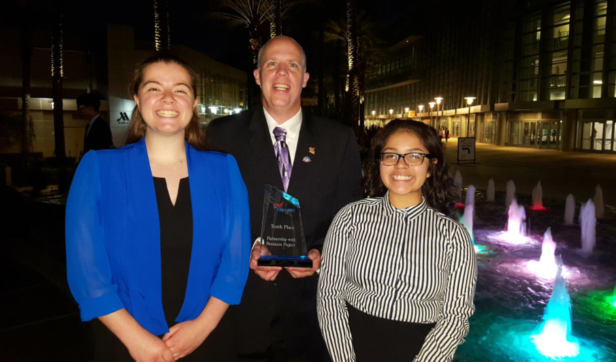 Orchards: Heritage High School Future Business Leaders of America members Victoria Thornton, from left, Bob Berrigan, faculty adviser, and Elvia Santos-Dominguez traveled to Anaheim, Calif., to participate in the organization’s national conference.