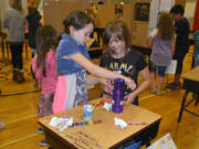 Washougal: Chloe Elliott, left, and Hannah Mancini at the Hathaway Elementary School’s Fifth Grade Science Fair.