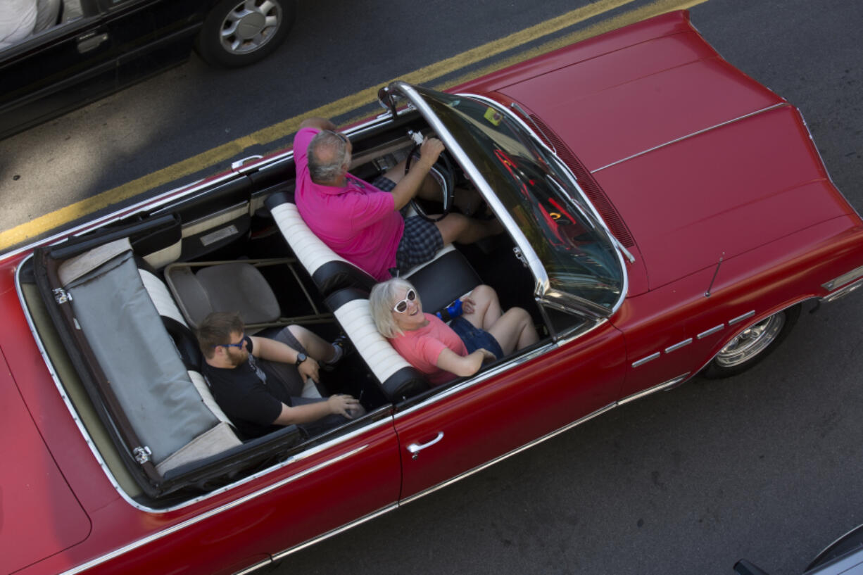 Drivers take part in the first Cruise the Couve event on Main Street Saturday in downtown Vancouver.