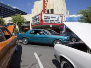 A vintage car passes the Kiggins Theatre during the inaugural Cruise the Couve on Saturday, which started as a replacement for Cruisin’ the Gut. City officials and Phil Medina, organizer of Cruisin’ the Gut, disagreed on a few contract items, so Medina dropped out, leading to a group of downtown business owners to swoop in and start their own event.