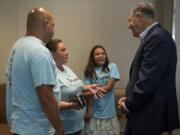 Gov. Jay Inslee, right, talks with Isabella Peiffer, 13, second from right, and her stepmom, Sandy, and dad, George, during Inslee’s Tuesday visit to Legacy Salmon Creek Medical Center. The Longview family was one of three Southwest Washington families to share their stories with the governor during a roundtable discussion about the Medicaid program.